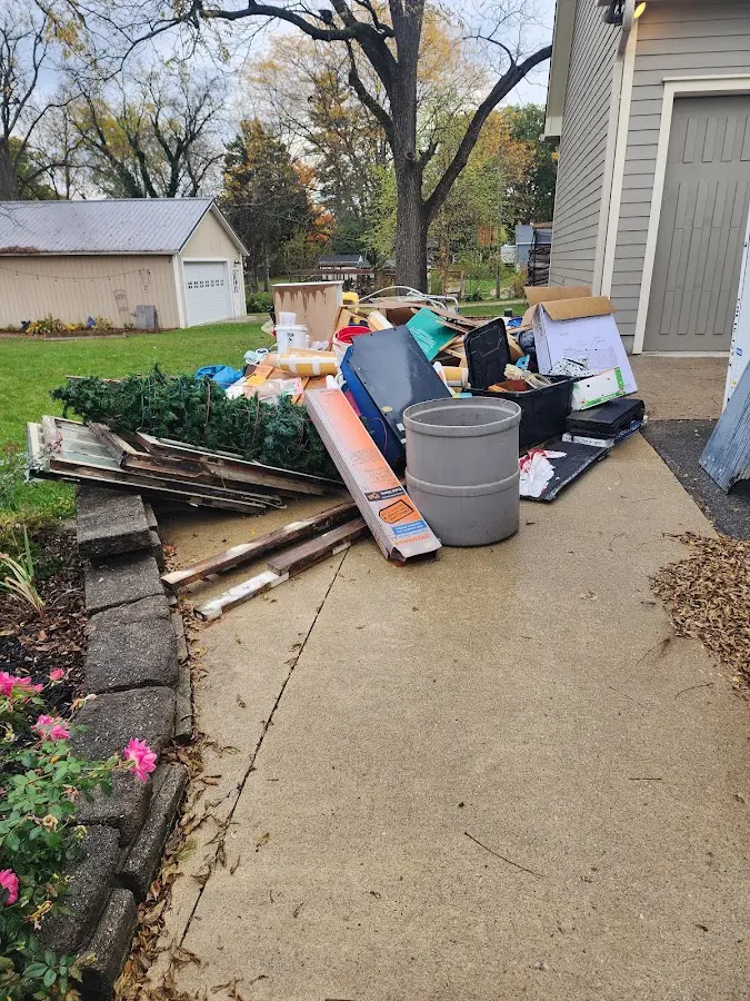 Dumpster being loaded with debris for Commercial Dumpster Rental in Masontown
